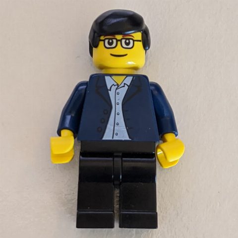 Minifigurka Man - Dark Blue Jacket, Black Legs, Glasses