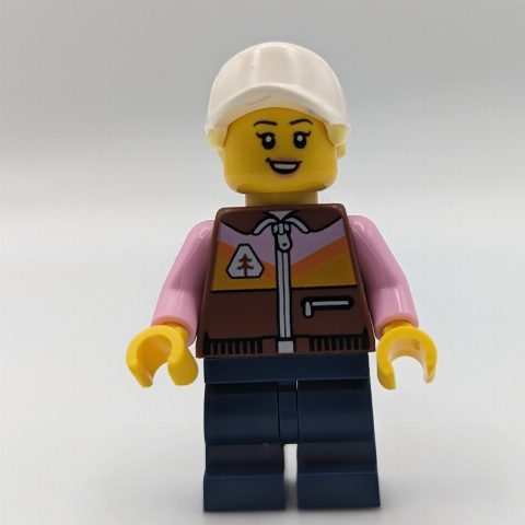 Minifigurka Dirt Bike Rider, Female - Reddish Brown Vest, Dark Blue Legs, White Cap with Ponytail