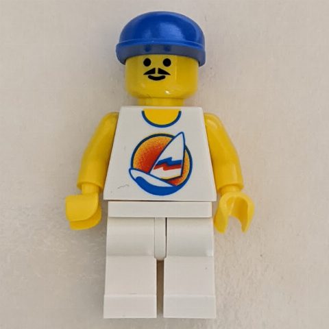 Minifigurka Man, White Tank Top with Windsurfer, White Legs, Blue Cap, Moustache