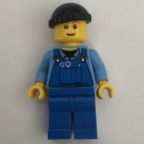 Minifigurka Man, Blue Overalls over Shirt, Blue Legs, Black Hat, Reddish Brown Eyebrows
