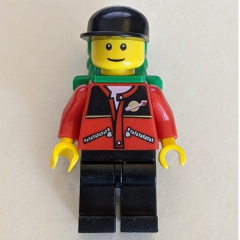 Minifigurka Man - Red Jacket, Black Legs, Black Cap, Green Backpack