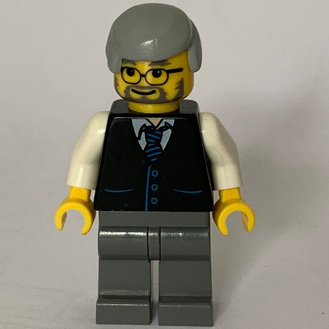 Minifigurka Man, Black Vest over White Shirt with Tie, Dark Bluish Gray Legs, Light Bluish Gray Hair, Beard and Glasses