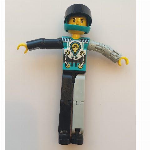 Minifigurka Technic Figure Black/Light Gray Legs, Dark Turquoise Torso with Yellow, Black, Silver Print, Light Gray Mechanical Left Arm - Dark Turquoise Helmet
