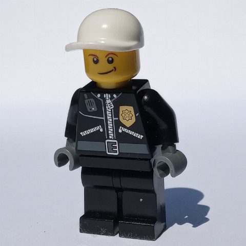 Minifigurka Policeman, Black Jacket with Zipper, Radio, Badge, and 'POLICE' on Back, White Cap (3626c Head)