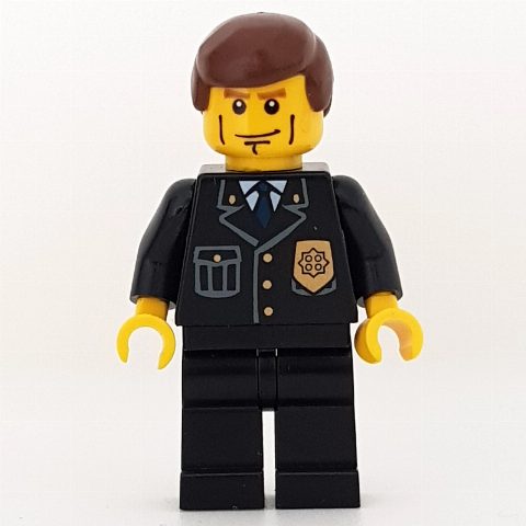 Minifigurka Policeman, Black Suit with Badge, Reddish Brown Hair
